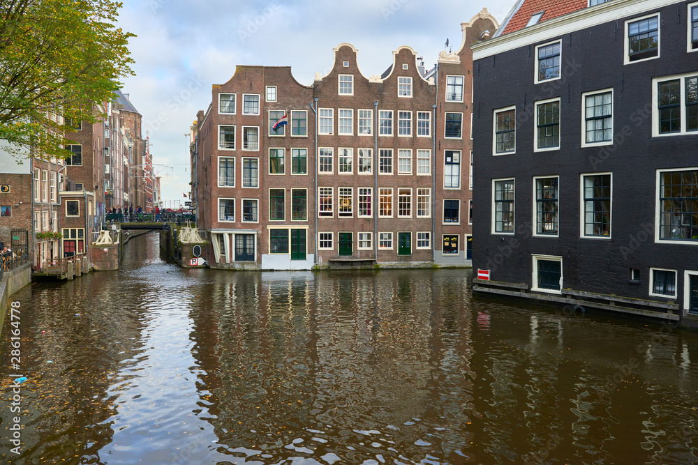 Naklejka premium Amsterdam city view in autumn day.