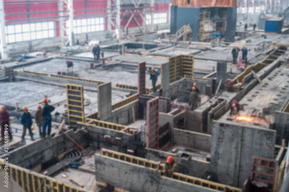 Raft foundation in workshop, building under construction, blurred image