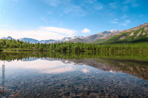 Clear water of the lake at sunny summer day. The Khibiny Mountains is on Kolsky Peninsula, northern Russia photo