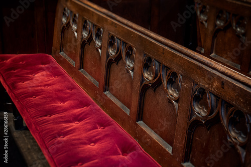 Εκτύπωση καμβά Church Pew with Red Velvet Cushion and Wooden Carvings
