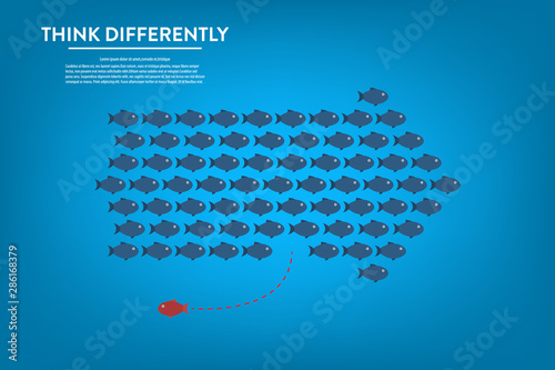 Think differently -One red unique different fish swimming opposite way of identical blue ones.  
