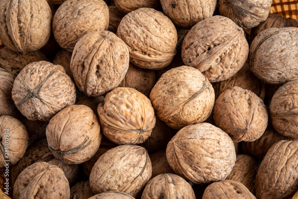 Natural background of many walnuts, top view Natural background of many walnuts, top view
