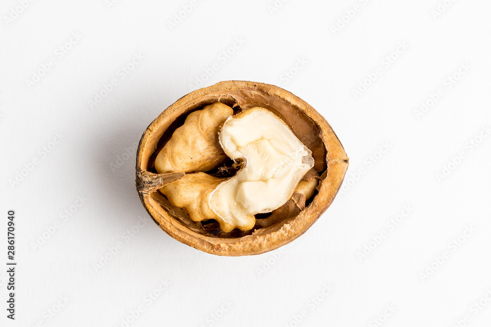 Half of cracked walnut isolated on white, top view Half of cracked walnut isolated on white, top view