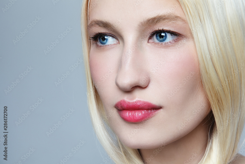 Close-up portrait of young beautiful blonde woman with clean makeup Close-up portrait of young beautiful blonde woman with clean makeup