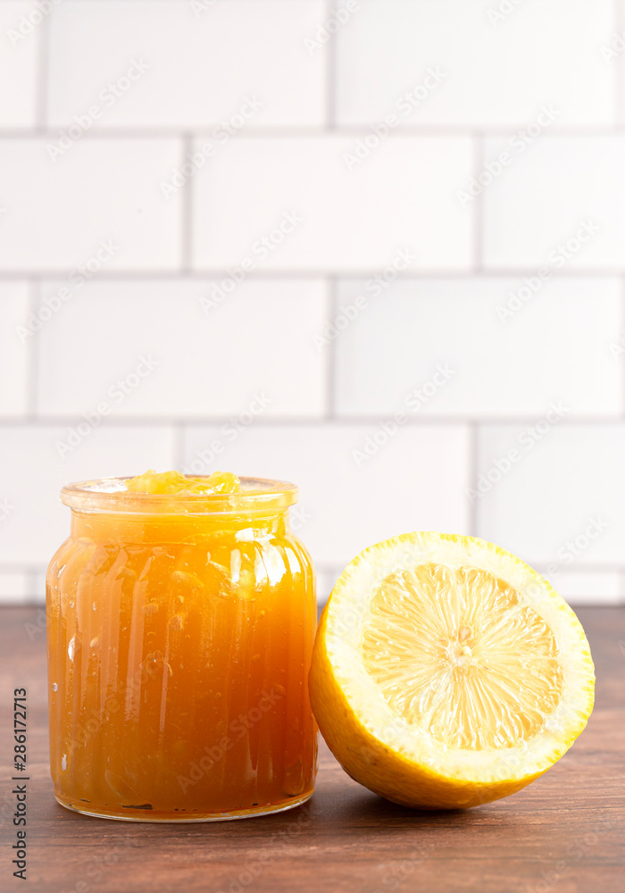 Jar of Lemon Curds on a Rustic Wooden Table Jar of Lemon Curds on a Rustic Wooden Table