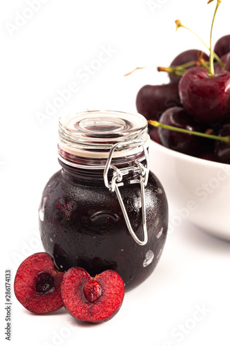 Jar of Homemdae Cherry Jam Isolated on a White Background photo