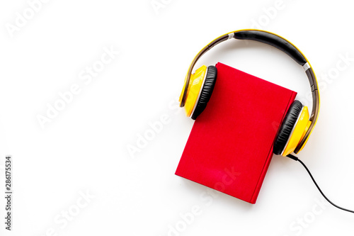 workplace with books and headphones on white background flatlay mockup