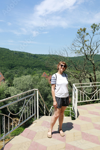 Woman posing on observation deck photo