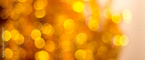 Abstract blurred background with bokeh in golden colors_