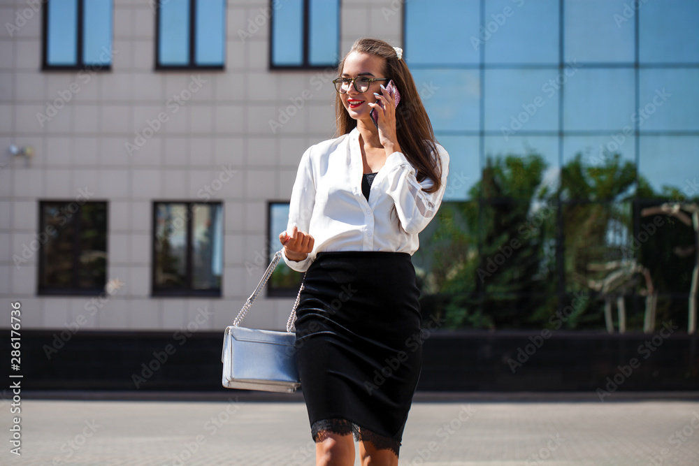 Young brunette woman calling by phone Young brunette woman calling by phone