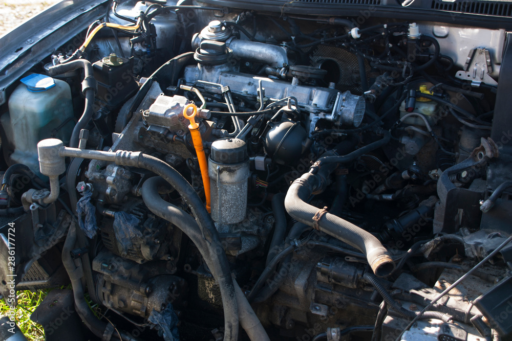 full size old diesel engine on a disassembled car full size old diesel engine on a disassembled car