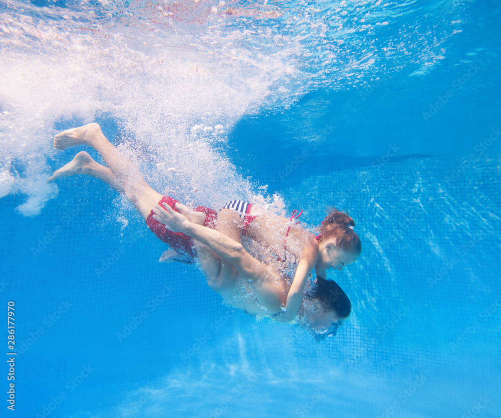 family in swimming pool