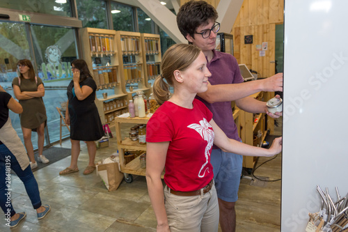 Happy couple shopping in a zero waste store. photo