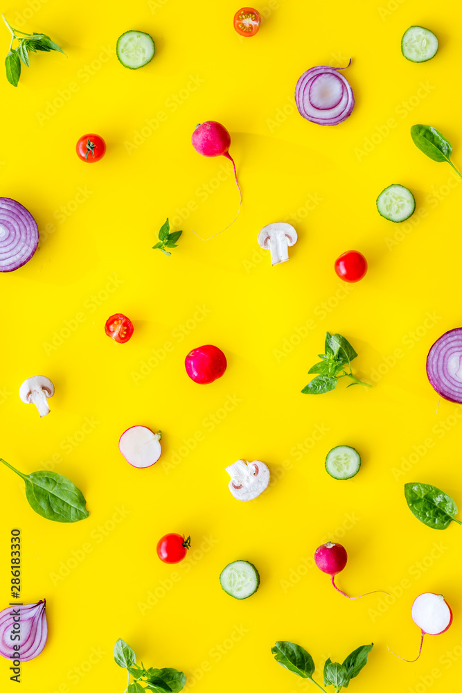 Layout of colorful vegetables on yellow background top view pattern Layout of colorful vegetables on yellow background top view pattern