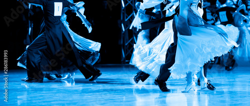 Obraz na plátně woman and man dancer latino international dancing. Blue filter