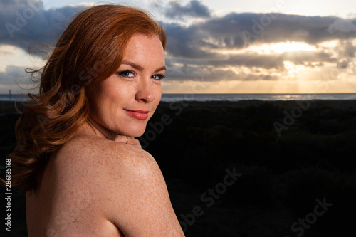 Portrait of pretty woman with red hair