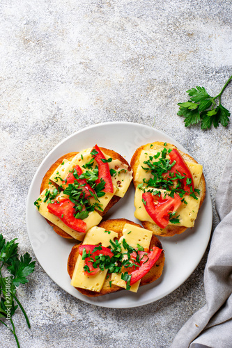 Grilled toast with tomato and cheese photo