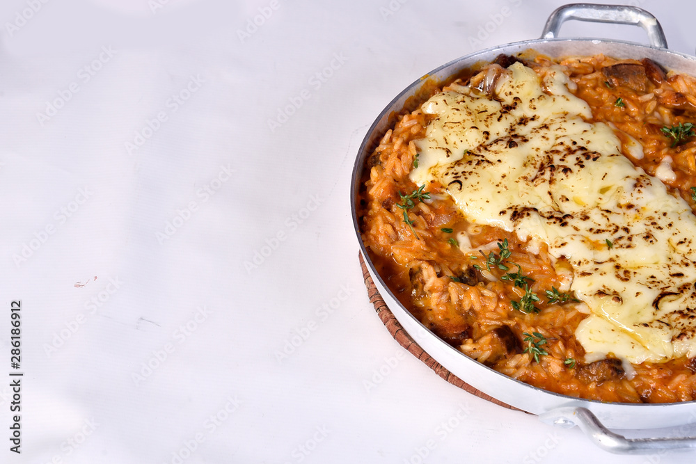 Sausage Risotto, Italian risotto served with Italian sausage and onion pepper mix ,tossing in spicy tomato sauce topped with parmesan cheese Sausage Risotto, Italian risotto served with Italian sausage and onion pepper mix ,tossing in spicy tomato sauce topped with parmesan cheese