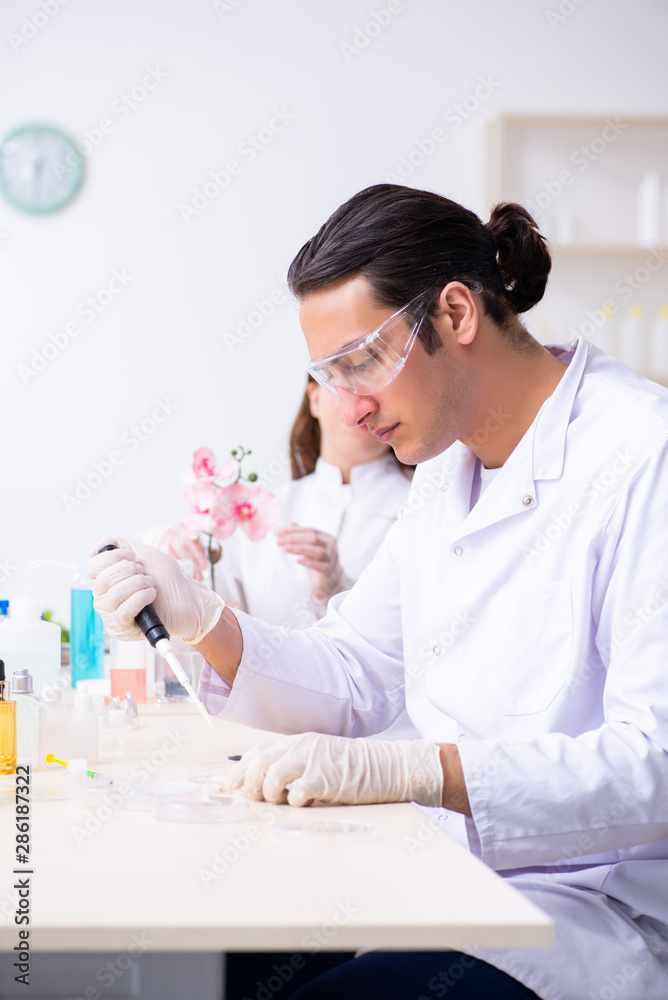 Two chemists working in the lab Two chemists working in the lab