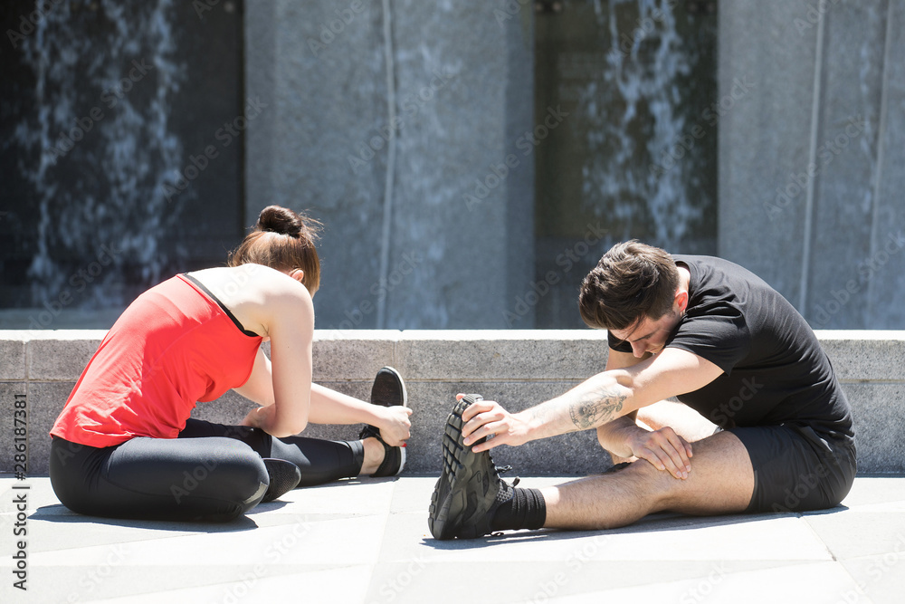 Healthy couple stretching in yoga exercise