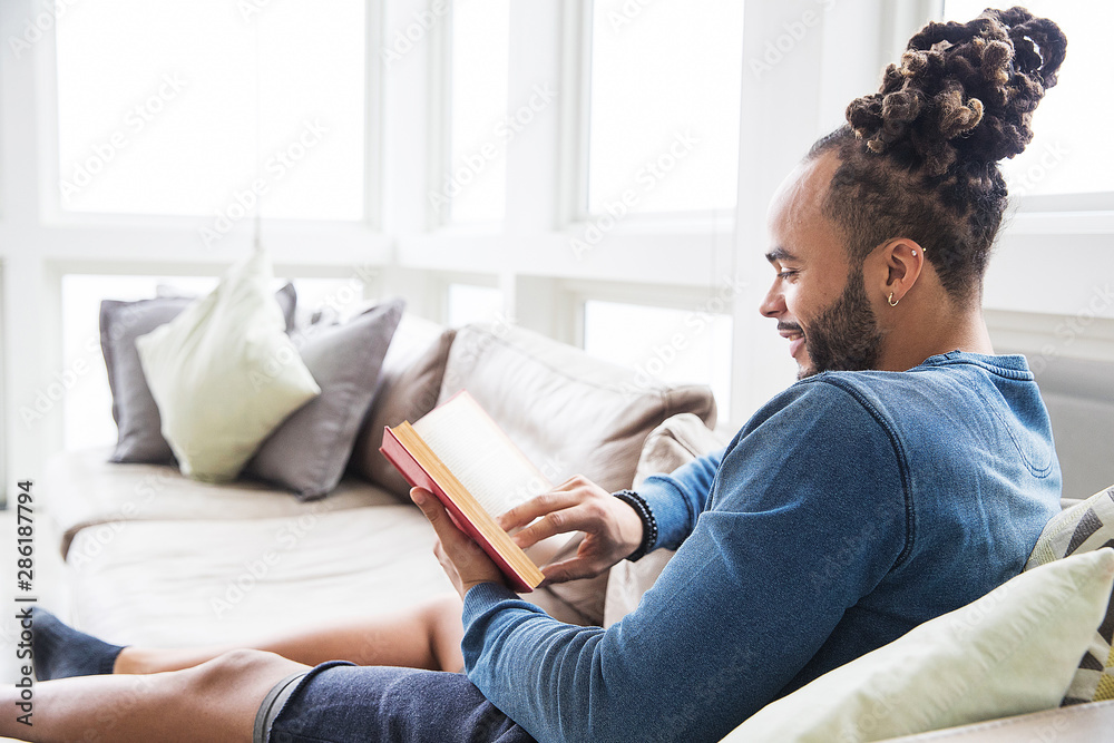 Handsome African American man with dreadlocks at home Handsome African American man with dreadlocks at home