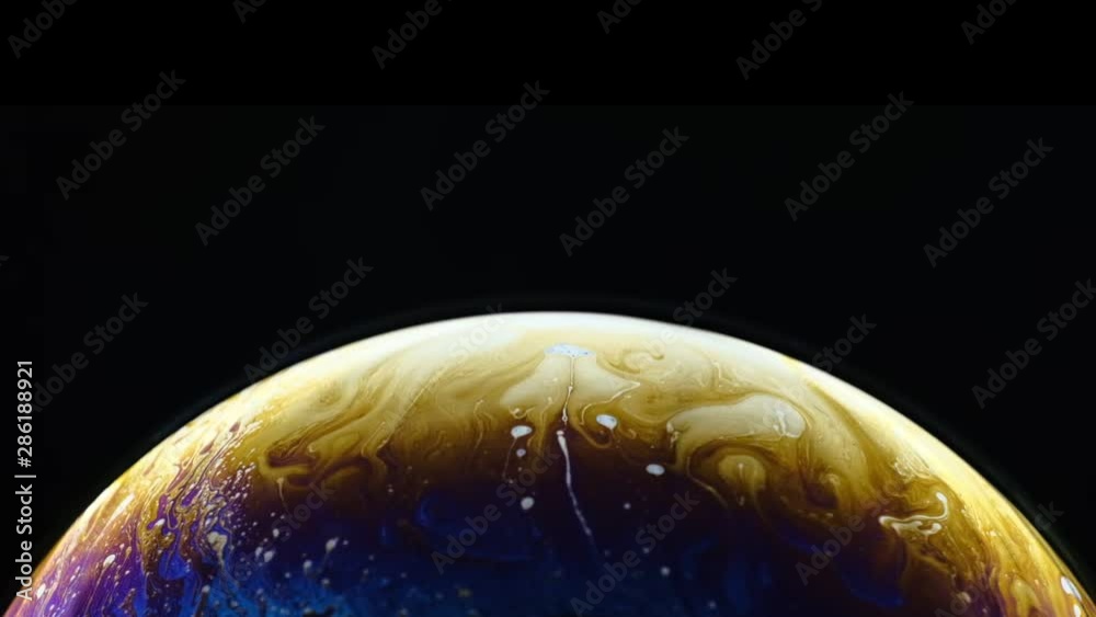 Virtual reality space with abstract multicolor psychedelic planet. Closeup Soap bubble like an alien planet on black background. Virtual reality space with abstract multicolor psychedelic planet. Closeup Soap bubble like an alien planet on black background.
