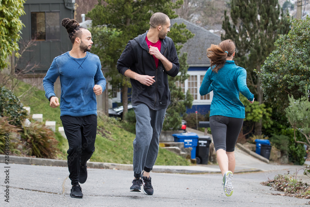 Fototapeta premium People jogging together outside