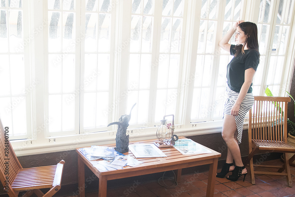 Pretty woman inside house Pretty woman inside house