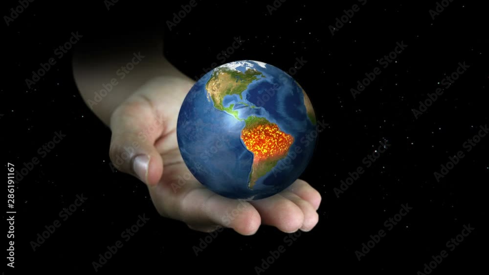 Amazon forest fire burning Earth. Planet apocalypse in man hand. CG animation Amazon forest fire burning Earth. Planet apocalypse in man hand. CG animation