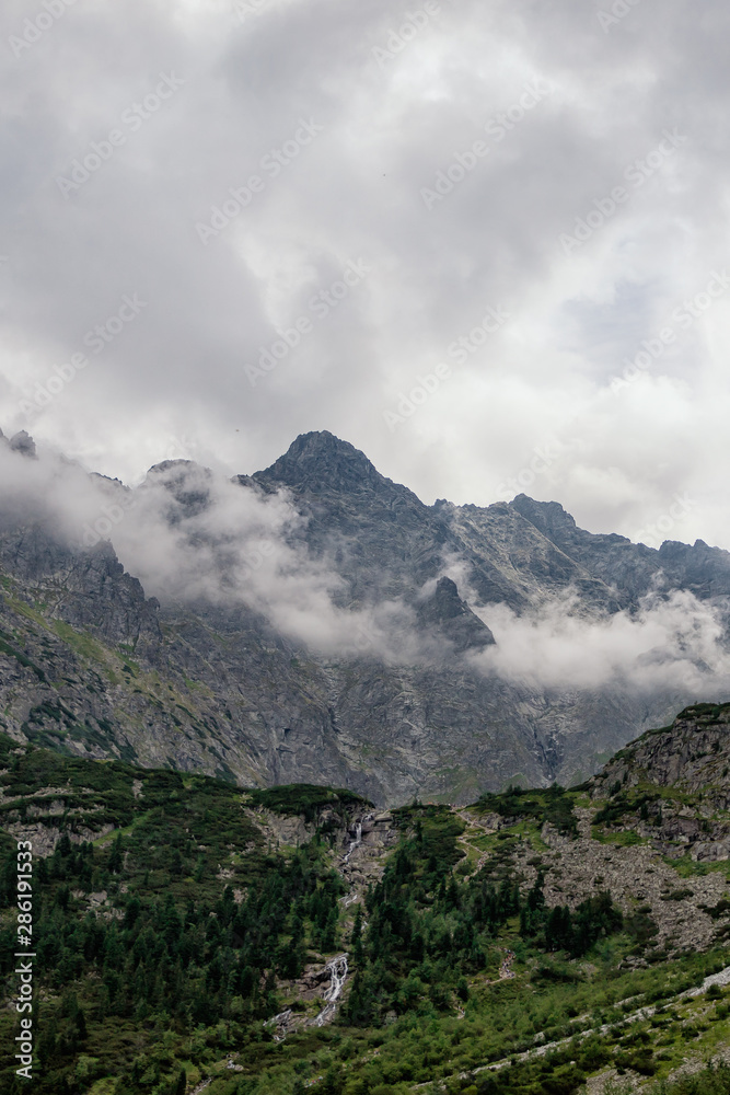 Mountain peaks. Tatra mountains and white clouds. National park, Poland
