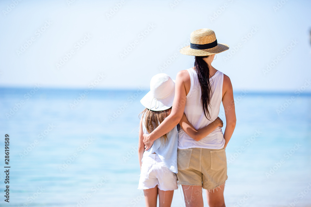 Beautiful mother and daughter on Caribbean beach Beautiful mother and daughter on Caribbean beach
