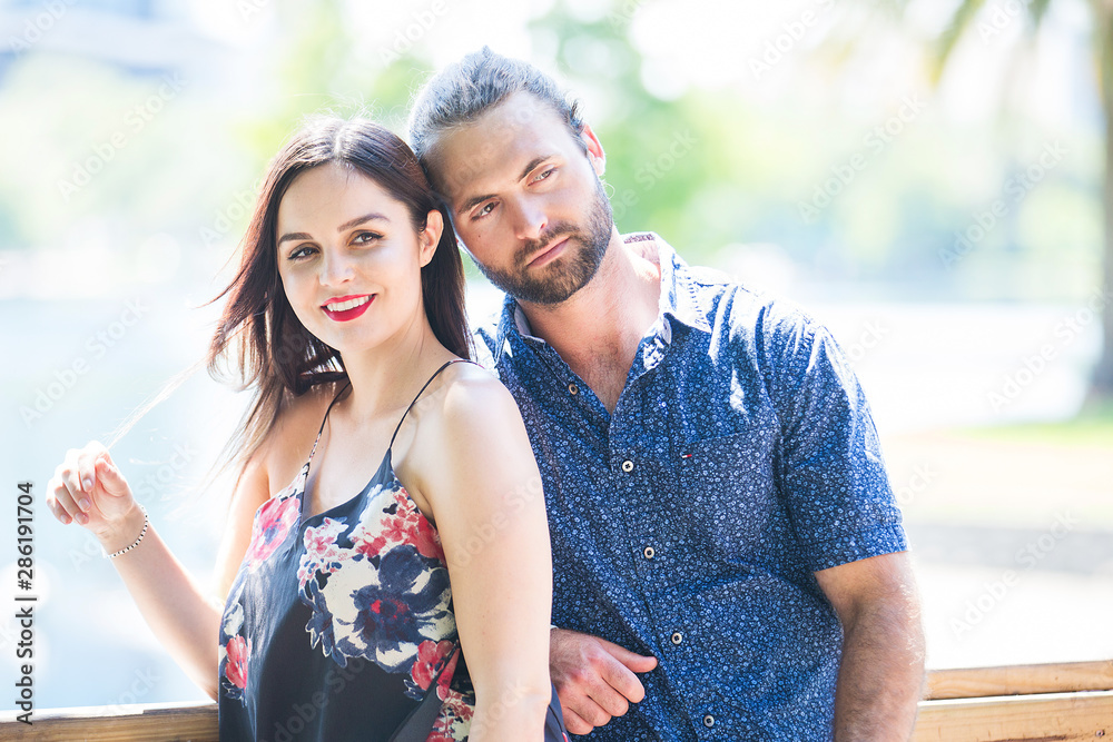 Naklejka premium Young attractive couple together outside