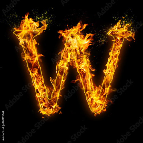 Letter W. Fire flames on black isolated background, realistick fire effect with sparks. Part of alphabet set