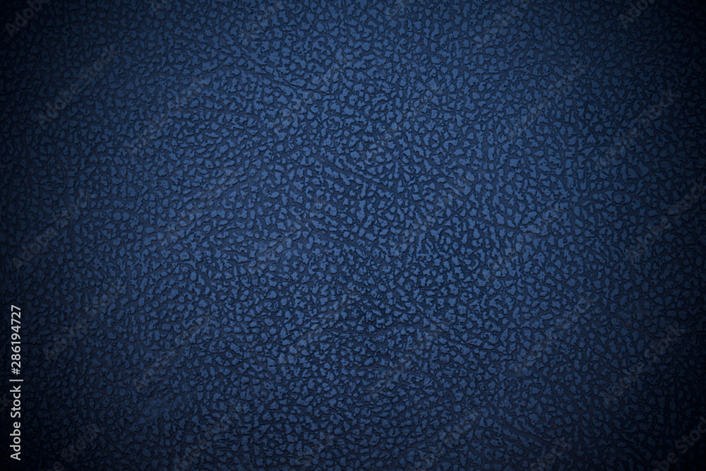 Old blue faux leather. Dark dermatin. Close-up. Background. Texture. Old blue faux leather. Dark dermatin. Close-up. Background. Texture.