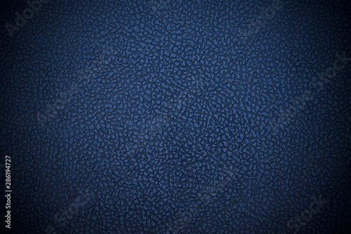 Old blue faux leather. Dark dermatin. Close-up. Background. Texture. photo