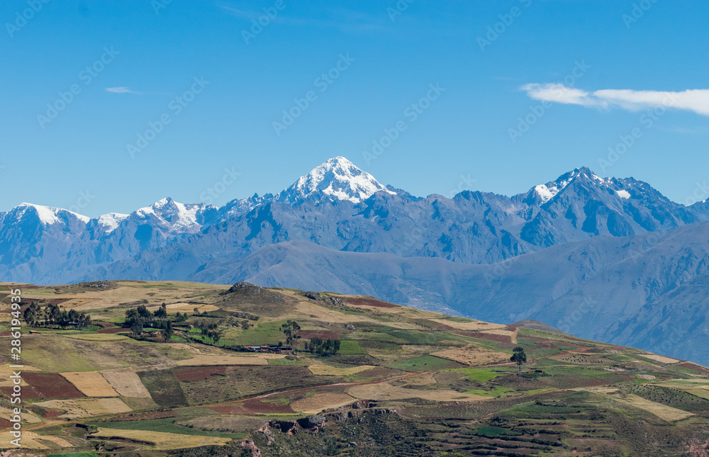 Sacred Valley, Peru - 05/21/2019: The inescapable snow peaked Andes mountains in the Sacred Valley of Peru.