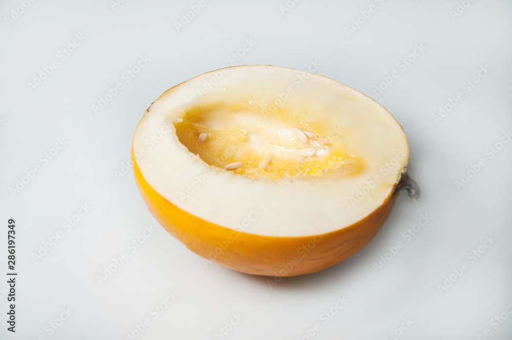 Composition on white background with melon