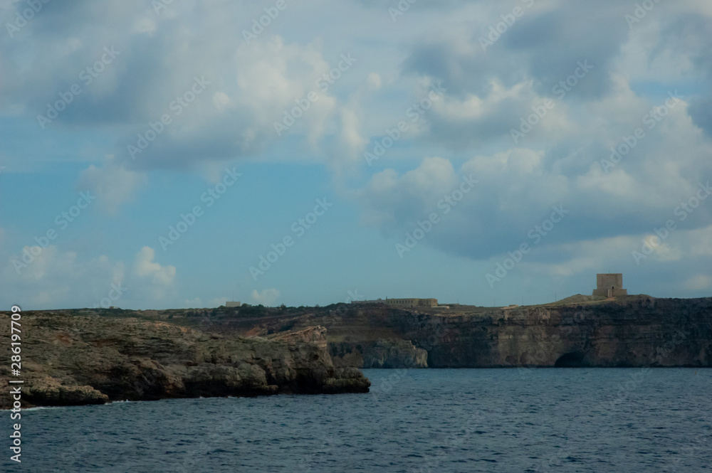 Malta beach with rocks and blue water