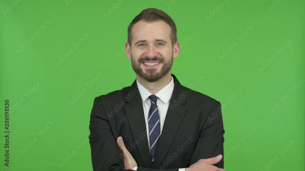 Businessman Smiling with Arms Crossed against Chroma Key Businessman Smiling with Arms Crossed against Chroma Key