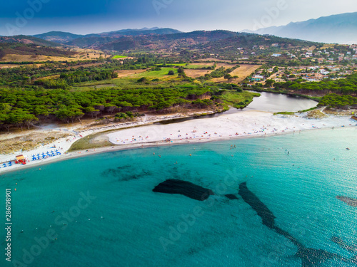 Graniro beach with Santa Lucia old town on Sardinia island, Italy, Europe photo