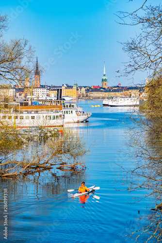 Sticker a man on kayak admires Gamla stan in Stockholm, Sweden