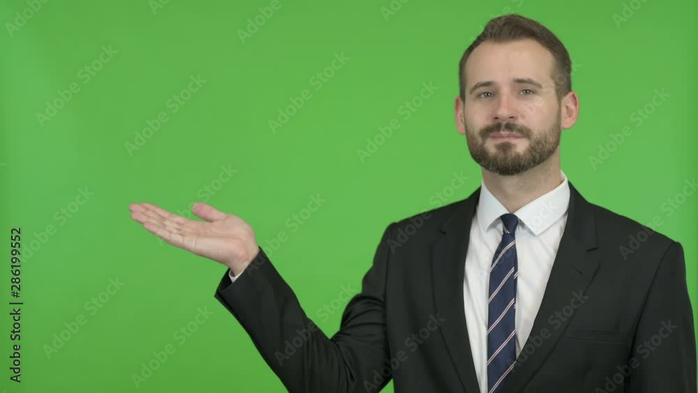 Businessman Holding Something without theme against Chroma Key Businessman Holding Something without theme against Chroma Key