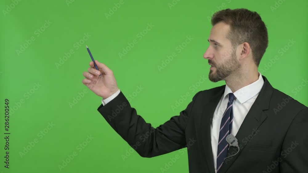 Ambitious Businessman giving Presentation on Board against Chroma Key