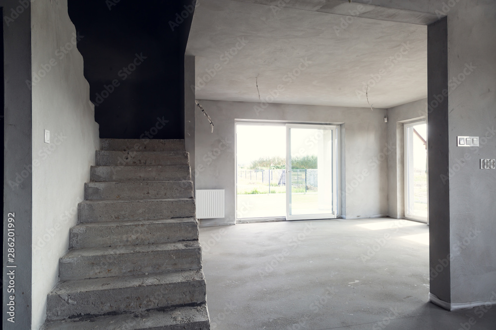 Interior of the building in the developer state. Finishing rooms.