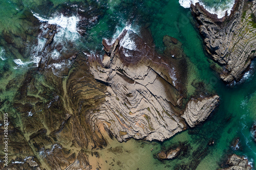Aerial view of the rock formations at the Carreagem Beach in Aljezur, Algarve; photo