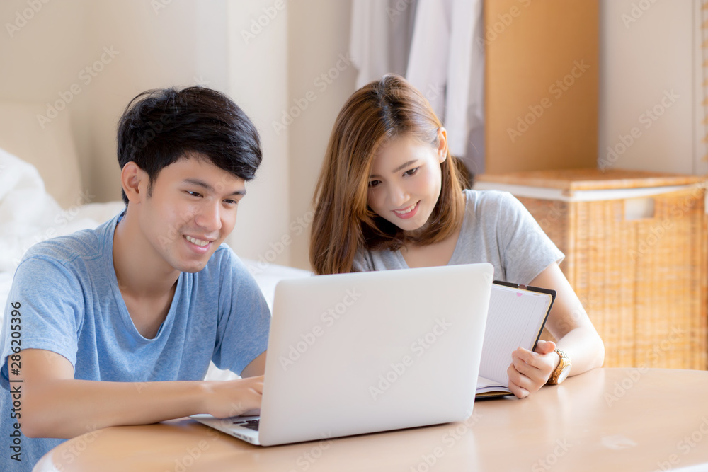 Beautiful young asian couple calculate expenses finance with laptop and planning together, woman writing notebook or note budget household, lifestyle family and business concept. Beautiful young asian couple calculate expenses finance with laptop and planning together, woman writing notebook or note budget household, lifestyle family and business concept.