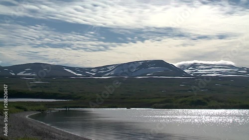 WS Naknek Lake, zm into two anglers crossing mouth of American Creek photo