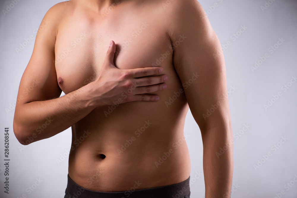Young man suffering from heart attack Young man suffering from heart attack