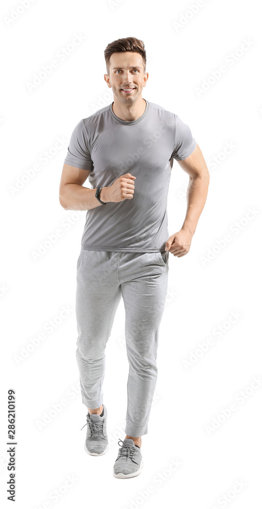 Fototapeta premium Running young man on white background