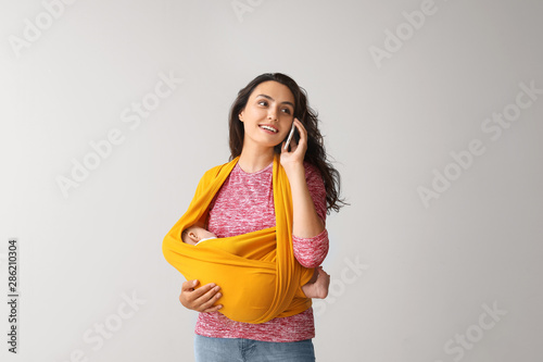 Young mother with little ba...